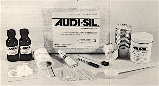 Figure 3.  Audi-sil instant earmold material.  The kit contains enough for 16 ear molds.  It includes a jar of silicone putty, scoop, tube of accelerator, cement, sealer, pre-formed tubing, tube puller, earmold drill, pre-tied cotton blocks, cups, storage envelopes, and instructions.