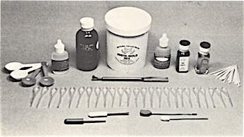 Figure 2.  Insta-mold kit containing everything to make an on-the-spot earmold.  Insta-mold mix, hardener paste, hand lotion, insta-cement, applicators, core drill, plunger, tube threader, pre-formed tubing, measuring spoons, packing tool, instal-seal Kote.