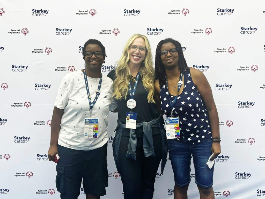 Starkey team member Sarah Roggenbuck (middle) is shown with Special Olympics athletes, Sharita and Shaye Taylor